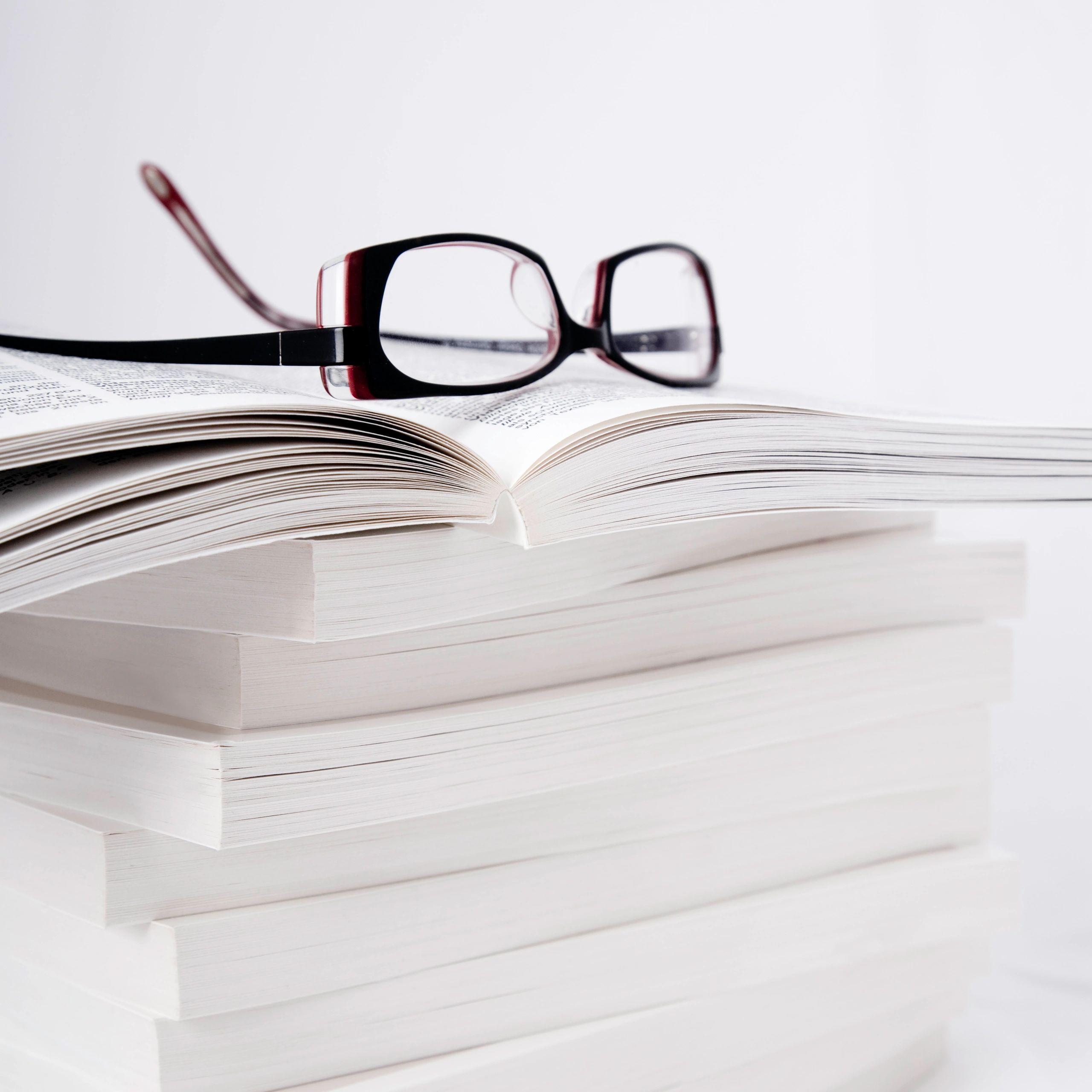 Reading glasses on open book